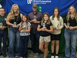 Swine record book winners pictured left to right: Rocco Cohen, Karen Rowley, Saraya Rowley, Aidyn Starr, Layton Lowe, Baylee Stephens and Addison Wetherington.